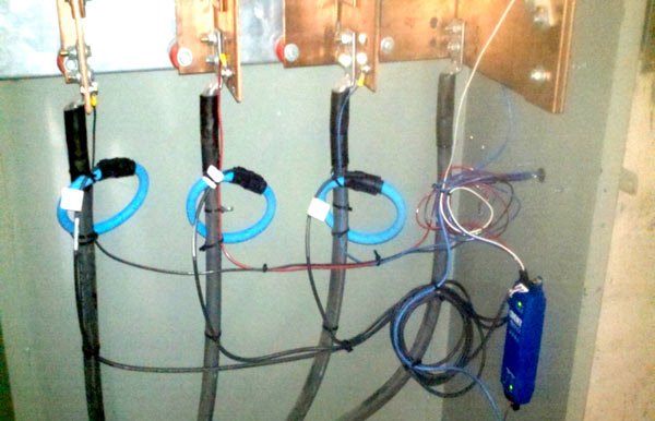 Sensor coils around electrical service lines